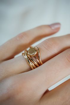 A curved arc stacking ring made from 14K Gold Fill Metal. After countless requests and some fine tuning, we finally perfected this ring shape! The Teardrop Ring stacks with all of our rings beautifully. It adds dimension to any stacking rings you wear daily but it also makes the perfect, low-key wedding band! The bend in the Teardrop Ring curves to hug a set stone beautifully if you are looking for a complimentary piece for your existing engagement ring. This listing is for ONE SINGLE RING.Made Gold Stackable Signet Ring In Recycled Gold, Gold Oval Stackable Midi Rings, Everyday Heirloom 14k Gold Stackable Rings, Everyday Heirloom Style Stackable 14k Gold Rings, Gold Minimalist Stackable Bypass Ring, Gold Handcrafted Stackable Rings, Minimalist Gold Stackable Bypass Ring, Gold Stackable Rings With Polished Finish And Modern Twist, Dainty Hand-forged Rings In Recycled Gold