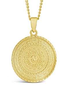 Say goodbye to boring pendants. This elaborate gold-tone piece is sure to add a little bit of flair to your OOTD! It features a series of patterns around a central face. Layer it with other necklaces from your jewelry box, or let it stand out all on its own. Materials: 14K gold plated brass Features: Measures 24" with 2" extender, 20mm coin pendant, Lead & Nickel free, lobster clasp Gold Medallion Necklace, Solid Gold Bracelet, Real Gold Jewelry, Engraved Metal, Gold Medallion, Wrist Wear, Gold Charm Necklace, Statement Drop Earrings, Medallion Necklace