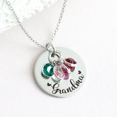 Whether you're looking for a gift for Mother's Day, a birthday, or just because, this necklace is the perfect way to show your grandma how much you care. You can also add birthstones as the family grows! At HeartfeltTokens, our customized jewelry is expertly engraved and made with high-quality stainless steel to ensure a timeless design that won't fade over time. All of our items are 100% designed, engraved, and shipped to you from our home studio in Florida, so I thank you for supporting our sm Grandmother Necklace Birthstones, Mothers Day Jewelry, Grandmother Necklace, Personalized Grandma Gifts, Personalized Grandma, Customized Jewelry, Flower Girl Gifts, Circle Necklace, Birthstone Charms