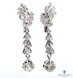 A sleek and sexy pair of ART DECO Diamond Drop Earrings with bright and sparkling Old European diamonds in Buttercup settings suspend from glittering fanciful diamond flares in these almost 1 3/4 inches long and extraordinarily lovely and lustrous drop earrings crafted in 18K White gold and together weighing 3.25 carats, dating from CIRCA 1930s.The Old European cut diamonds drops are set into butternut cup, weighing 1.31ct - L SI2 and 1.14ct - K SI2, GIA certified ( copies of GIA are shown). Stu Art Deco Earrings, European Cut Diamonds, Earring Crafts, Art Deco Diamond, Antique Diamond, Diamond Drops, Diamond Drop Earrings, Gia Diamond, Jewelry Ideas