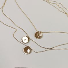 Delicate gold initial disc necklace. Personalized hand stamped gold filled or silver circle necklace. Perfect everyday necklace and great for layering with longer chains or a sweet gift for moms, sisters or friends. *** 14k gold filled, rose gold filled or sterling silver disc. *** Initials stamped by hand. *** Satin finish, hammered or hammered edge. ***Chain is 16"to18"adjustable Disc measurement : 1/2" inches (13mm) diameter. You can choose material ( sterling silver , yellow gold filled or r Initial Disc Necklace, Gold Disc Necklace, Custom Initial Necklace, Gold Coin Necklace, Hand Stamped Necklace, Gold Disc, Silver Circle, Mothers Necklace, Hammered Gold