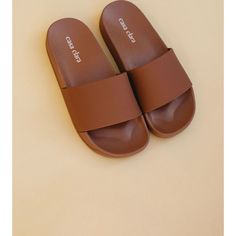 Get out of the slippers and get into the Tommy streamlined pool slides. Tommy is the best beach buddy, next to sunscreen. With a streamline single strap, and monochromatic style, Tommy is meant for casual beach days, pool strolls, and lake visits. - monochromatic single strap pool slide - 100% EVA rubber Small: 6-7 Medium: 7-8 Large: 8-9 | Casa Clara | Women's Tommy Slide Shoes, Terracotta (Brown, Size Large)  |  Maisonette collects the best children’s products from around the world (unlike Zuli Brown Pillow Slides, Monochromatic Style, Slide Shoes, Im So Fancy, Pool Slide, Teen Shopping, Slides Shoes, Beach Days, Pool Slides