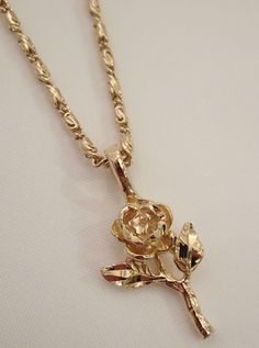 The Rose Necklace is a blooming beauty. It's the ultimate golden rose necklace that is sure to make all other rose flower necklaces jealous. This dainty darling features a diamond cut rose pendant and is available in a silver rose necklace too! Available in 24K gold or rhodium plating over steel Patent plating & sealant technology to ensure durability and long lasting wear Made in Los Angeles, CA | Nickel & Lead Free Dope Jewelry Accessories, Flower Necklaces, Pretty Jewelry Necklaces, Golden Necklace, Jewelry Accessories Ideas, Dope Jewelry, Rose Pendant, Rose Necklace, Jewelry Fashion Trends