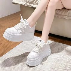 Elevate your style with our Chic White Platform Sneakers for Women. Designed to be both trendy and stylish. these white platform sneakers will add a touch of sophistication to any outfit. Made with high-quality materials. these white platform sneakers provide comfort and support. while the platform sole gives you just the right amount of height. Don't miss out on this must-have footwear for any fashion-forward woman.How to Choose the Right Size:1. Measure your foot length while standing. paralle Sneakers For Women Trendy, Crocs Fashion, White Platform Sneakers, Stylish Footwear, Shoes Outfit Fashion, Mid Heels Pumps, White Platform, Cute Nikes, Sneakers For Women