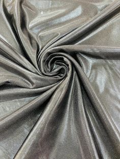 a close up shot of a shiny silver fabric