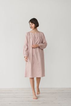 "MONA gather dress made from soft linen in dusty pink. - length is ± 107 cm (42\") (depends on size) - gathered front, back and sleeves - loose fit - without pockets DETAILS: - 100 % European, pre-washed medium weight linen (205 g/m²) - the model is 176 cm (5′9″) high, wearing size S. - model measurements: bust 83 cm (33\") / waist 61 cm (24\") / hips 90 cm (36\") - color in the picture - dusty pink (you can choose other color on the right) MADE TO ORDER: All pieces are made to order, it will ta Pink Long Sleeve Nightgown For Nighttime, Pink Long Sleeve Nightgown, Pink Long Sleeve Dresses For Night, Feminine Long Sleeve Sleep Dress, Feminine Long Sleeve Dress For Sleepover, Feminine Long Sleeve Loungewear Dresses, Feminine Long Sleeve Dresses For Loungewear, Pink Midi Dress With Gathered Sleeves For Daywear, Gather Dress