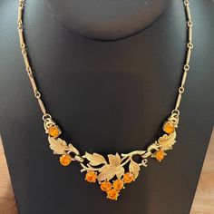 Coro Pegasus patent pending necklace from the 1940s.  This Coro necklace has gold tone links that hold a stunning leaf design.  The gold tone leaves are very detailed and are highlighted by golden orange rhinestones.  The necklace is adjustable from 13 to 16 inches. Outstanding condition.  All jewelry comes in a gift box. Vintage Necklaces, Rhinestone Necklace, Jewelry For Women, Bolivia, Leaf Design, Vintage Necklace, Chains Necklace, Vintage Jewelry, Gold Tones