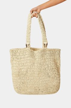 The Billini Ocean Tote Bag is the perfect companion for beach trips. This chic and stylish bag is made of natural raffia and is perfect for storing all your beach day essentials. With its large size and comfortable handles, it is a great bag for a relaxed day at the beach. Casual Everyday Bags Made Of Natural Fiber, Neutral Rectangular Shoulder Bag For Beach, Rectangular Neutral Shoulder Bag For Beach, Chic Summer Bags Made Of Natural Fiber, Chic Beach Bag Made Of Natural Fiber, Large Capacity Neutral Bag For The Beach, Large Capacity Neutral Bag For Beach, Casual Neutral Beach Bag, Chic Natural Straw Beach Bag