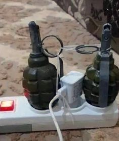 two bottles are plugged into an electrical device