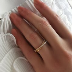 a woman's hand with a ring on it