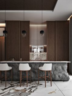 a kitchen with marble counter tops and white chairs