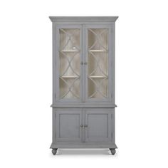 a gray china cabinet with glass doors on the top and bottom shelves, in front of a white background