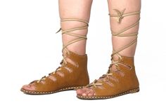 Antique Tan Women's Lace-up Gladiator Sandals made entirely of genuine leather. Discover more colors and models. https://www.etsy.com/shop/NaturalShoesStore MATERİALS -Completely genuine antique tan leather (Since our product is completely leather, there may be slight variations in color tone, albeit with a low probability) -Buffalo leather laces (Since the laces are buffalo leather, they do not break or tear under normal conditions, you can request a spare lace for an optional $5 fee.) -Thick b Brown Leather Lace-up Sandals For Summer, Brown Leather Lace-up Sandals For Beach, Brown Leather Lace-up Sandals With Leather Sole, Beige Leather Lace-up Sandals, Bohemian Brown Leather Lace-up Sandals, Tie Up Boots, Natural Leather Sandals, Taupe Sandals, Barefoot Boots