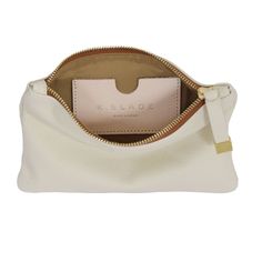 The smaller of our organizational pieces, the Tip Pouch in cream is an easy addition to your travel lineup, and it fits perfectly in our larger handbags. We recommend it for electronic accessories, small cosmetics, jewelry and chargers during travel. White Functional Cosmetic Bag With Zipper Pouch, White Functional Cosmetic Bag With Zipper, Functional White Cosmetic Bag With Zipper, White Rectangular Travel Accessories For On-the-go, Portable White Pouch For Travel, Modern Portable Pouch For Everyday Use, White Travel Cosmetic Bag With Removable Pouch, Chic Everyday Pouch With Cell Phone Pocket, White Portable Travel Pouch