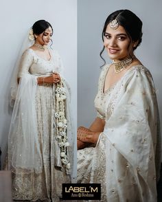 a woman in a white sari and headpiece posing for the camera with her hands on her hips