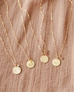 Create a polished palette of togetherness and keep your kin close to heart. Choose from over 130 illustrative symbols for your main pendant, plus a subtle birthstone charm to represent each of your loved ones! Each piece includes one charm (but you can add up to five). The hue of each gem will softly shift depending on the lighting and angle: a tribute to the beautiful multifaceted nature of family. Add an extra gemstone as your story grows, and check out our journal for more about the symbolism Pink Tourmaline Crystal, Ruby Crystal, Birthstone, Disc Necklace, Tourmaline Crystal, Birthstone Charms, White Sapphire, Birthstone Necklace, Pink Tourmaline