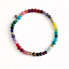 Our happy Rainbow bracelet is bright and projects a feeling of happiness - made with a mix of gemstones such as: Malachite, Firestone, Turquoise, Coral, Jade, onyx, Amethyt, Rose Quartz, Tigereye, Garnet, Lapis etc. 14k solid gold beads are strung between the gemstones  Details: ✦ 14k solid gold Beads ✦ Stretch elastic ✦ 4mm gemstone beads ✦ 4mm solid gold beads  ✦ Our 14k gold is hallmared with VFD and 585 ( 14k) stamp ✦ NEW: Also available in Gold fill and Sterling silver ✦ Matching necklace c Multicolor Gemstone Beaded Bracelets As Gift, Spiritual Multicolor Round Stretch Bracelet, Rainbow Natural Stones Beaded Bracelet As Gift, Colorful 8mm Bead Stretch Bracelet Gift, Multicolor Stackable Spiritual Beaded Bracelets, Multicolor Spiritual Stackable Beaded Bracelets, Multicolor Natural Stones Stretch Bracelet For Healing, Multicolor Gemstone Spiritual Stretch Bracelet, Spiritual Rainbow Stretch Bracelet Gift