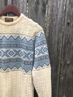 This is a cool sweater for anyone that loves the 50's and 60's. If you want to look great everywhere you go, get this beauty now. It is in okay condition but has staining at the bottom and on the sleeve, all pictured. We didn't have it dry cleaned so it could come out. There are no rips, holes or smells. Measurements: Pit to pit: 18 inches Collar to bottom front: 23 1/2 inches Collar to bottom back: 26 inches Sleeve Length (from collar): 27 inches Size on tag: Small Retro Cotton Beige Sweater, Retro Beige Cotton Sweater, Vintage Fall Sweater For Cold Weather, Fall Vintage Sweater For Cold Weather, Retro Knitted Sweater For Fall, Retro Knitted Sweater For Winter, Retro Beige Cardigan For Winter, Retro Beige Winter Cardigan, Retro Cotton Sweater With Knit Fabrication