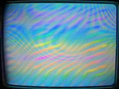 an old television with colorful lines on the screen