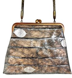 an image of a purse that is made out of wood and plastic material with metal handles