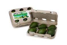 an egg carton filled with green avocados