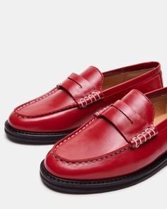 Upgrade your shoe game with the MADISON loafer. Crafted with luxurious leather, this stylish shoe adds a touch of sophistication to any outfit. Step into comfort and class with every step. 1 inch heel height Leather upper material Leather lining Leather sock Synthetic sole Imported Red Slip-on Loafers With Plain Toe, Classic Slip-on Loafers With Red Sole, Classic Loafers With Red Sole For Office, Classic Tassel Loafers With Red Sole, Classic Loafers With Red Sole For Work, Classic Red Leather Slip-ons, Classic Red Tassel Loafers For Business, Red Oxfords With Rubber Sole For Work, Classic Red Oxfords For Work