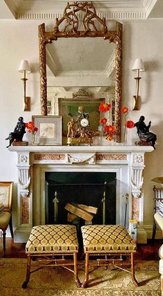 a living room filled with furniture and a fire place covered in a mirror next to a fireplace