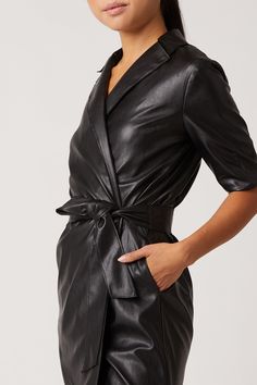 Our Robin Vegan Leather Dress, is a sultry trench dress that signifies everything chic. This bold black mini has 3/4 length sleeve detail, is made of our Vegan Leather with Japanese Technology, and hits above the knee in length. 100% Vegan Leather - 100% Polyurethane Dry Clean Only Made in USA Model is 5'11 and wearing size S Sleek Knee-length Mini Dress For Fall, Elegant Mini Dress For Work With 3/4 Sleeves, Black Belted Blazer Dress For Work, Chic Fall Mini Dress With 3/4 Sleeves, Fall Knee-length Blazer Dress For Night Out, Belted Knee-length Mini Dress For Formal Occasions, Fall Formal Belted Mini Dress, Knee-length Blazer Dress For Fall Night Out, Chic Formal Mini Dress With 3/4 Sleeve