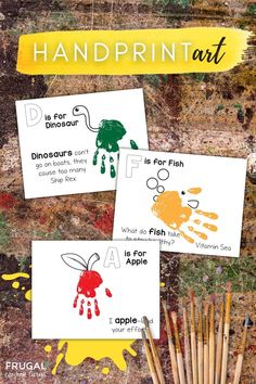 three handprint art cards with paint and brushes