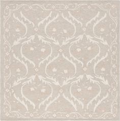 a beige and white rug with an intricate design