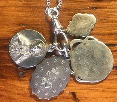 "DEVOTIONAL Collection - Mary, Sacred Heart of Jesus, Regina, Carmeli, Miraculous Medal - Catholic Medals on Key Fob & 18\" sterling chain, features a strong lobster claw clasp. Four medals on a sterling key fob. Hangs 2\" in height including the key fob. Vintage medals on new sterling chain and new key fob. The medals are sterling or silverplated." Floral Wrapping Paper, Sacred Heart Of Jesus, Catholic Medals, Heart Of Jesus, Miraculous Medal, Sacred Heart, Sterling Silver Heart, Key Fob, Silver Heart