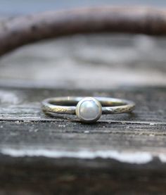 Tiny sterling silver fresh water pearl ring A petite 5mm white fresh water pearl is set in pure silver supported by a 1.63mm sterling band. ♥ pictured with oxidized/hammered finish White Pearl Ring, Silver Pearl Ring, Freshwater Pearl Ring, Tiny Rings, Zierlicher Ring, Stacking Ring Set, Jewelry Sale, Fresh Water Pearl, Burgundy Wedding