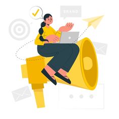 a woman sitting on top of a yellow bullhorn with a laptop in her lap