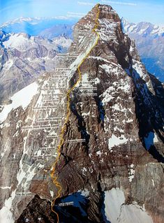 an aerial view of the top of a mountain with a yellow line going up it's side