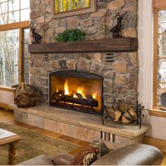 a living room with a fire in the fireplace