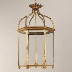 an antique brass lantern hanging from the ceiling