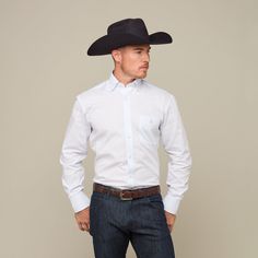 Named for the Texas city where Lucchese originated, this refined cotton shirt features a hidden button-down collar, open single-patch pocket with pen slot and a cowboy yoke in back for understated Western flair. A subtle, embroidered mirrored-L emblem on the left pocket and lower placket adds interest. Classic cowboy fit. Model is 6'1 and wearing size M. Texas City, Handcrafted Boots, Handmade Boot, Button Down Collar, Patch Pocket, Dia De Muertos, Cotton Shirt, Cowboy, Blue And White