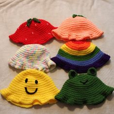 A crocheted bucket hat with many different styles! You can pick from frog, peach, rainbow, strawberry, funfetti, or a smiley face! These hats come in adult and child sizes, and make the perfect gift for friends and family, as well as yourself. Snag yours today! Cute Multicolor Sun Hat For Spring, Cute Handmade Hat With Curved Brim, Cute Knitted Hat For The Beach, Playful Crochet Yarn Hat, Cute Crochet Hat For The Beach, Cute Hand Knitted Crochet Hat For Beach, Cute Crochet Hat One Size Fits Most, Playful Brimmed Crochet Hat, Playful Handmade Brimmed Hats