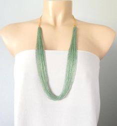 This stunning necklace comes with either gold or silver chain. The necklace has no clasp and it measures 30". More items in sage green: https://www.etsy.com/shop/StephanieMartinCo?ref=simple-shop-header-name&listing_id=159838186&ga_search_query=stephanie%2Bmartin&search_query=sage+green❤ PROCESSING AND SHIPPINGMost orders are made and shipped out in one business day. Please check delivery timeframes for your location on the description below.  ❤ CUSTOM ORDERSIf you like this item in Handmade Bohemian Green Emerald Necklace, Handmade Green Bohemian Emerald Necklace, Green Multi-strand Beaded Necklace As Gift, Green Multi-strand Beaded Necklace For Gift, Bohemian Long Green Necklace, Handmade Green Multi-strand Beaded Necklaces, Green Long Beaded Necklace, Handmade Green Multi-strand Beaded Necklace, Elegant Handmade Green Long Necklace