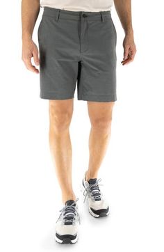 With the look of flat-front chinos and the performance features of swimwear, these hybrid shorts easily take you from the beach to the bar and beyond. The quick-drying technical fabric is made with recycled fibers, plenty of stretch and a hint of cotton for softness. 8" inseam; 10 1/2" front rise Zip fly with button closure; interior drawcord Front slant pockets; back-zip welt pockets Four-way-stretch fabric Mesh pocket linings 75% recycled polyester, 17% cotton, 8% spandex Machine wash, tumble Functional Bottoms With 5-inch Inseam For Summer, Summer Golf Shorts With Moisture-wicking, Moisture-wicking Shorts For Summer Golf, Moisture-wicking Golf Shorts For Summer, Sporty Golf Shorts For Summer, Summer Golf Moisture-wicking Shorts, Sporty Summer Athletic Shorts For Golf, Sporty Summer Golf Athletic Shorts, Sporty Summer Golf Shorts