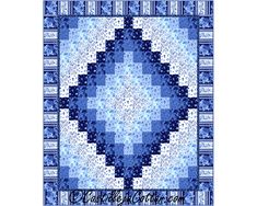 a blue and white quilt with an intricate design