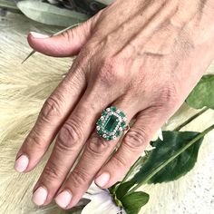 This One-of-a-Kind, Custom-Made Natural Emerald and Diamond Ring is a luxurious piece designed to captivate. Crafted in 14k gold, it showcases a finely faceted, high-quality natural emerald as the center stone, radiating deep green elegance and sophistication. The emerald is complemented by a stunning arrangement of brilliant diamonds that enhance its color and sparkle. Sized at 6.5 and resizable for a perfect fit, the ring has an impressive total carat weight (TCW) of 4.52 carats. Certified and Oval Multi-stone Emerald Ring In Platinum, Gia Certified Elegant Emerald Gemstones, Elegant Gia Certified Emerald Gemstones, Luxury Green Sapphire Ring Gia Certified, Green Gia Certified Sapphire Ring, Anniversary Multi-stone Emerald Cut Diamond Ring, Green Gia Certified Luxury Sapphire Ring, Emerald-cut Multi-stone Diamond Emerald Ring, Luxury Multi-stone Emerald Platinum Ring