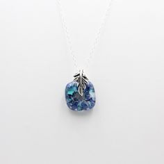 This delicate glass pendant has amazing depth! Speckles of blue, white, and turquoise are embedded in clear glass. Bail - silver plated bronze20 inch fairy chain - sterling sliver Electroformed Jewelry, Green Bottle, Recycled Glass, Glass Jewelry, Glass Pendant, White Glass, Glass Pendants, For The Home, Suncatchers