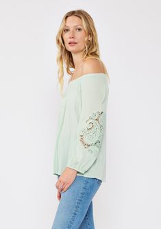 A casual bohemian blouse with a beautiful paisley lace detail on sleeve. Relaxed, flowy fit Elastic on or off-shoulder neckline 3/4 length sleeves Elastic wrist cuff Lace detail Flowy bohemian blouse Dry clean recommended or hand wash cold Step into effortless bohemian chic with this versatile blouse, beautifully designed with intricate paisley lace detailing. The relaxed fit effortlessly flatters any figure, while the elastic round neckline offers different styling options. Wear it as-is for a Bohemian Spring Tops With 3/4 Sleeves, Bohemian Off-shoulder Spring Tops, Fall Off-shoulder Tops With Lace Trim, Cotton Long Sleeve Off-shoulder Top, Casual Blouse With Lace Sleeves For Spring, Spring Off-shoulder Top With Lace Sleeves, Bohemian Flowy Tops With 3/4 Sleeves, Off-shoulder Lace Top Blouse For Summer, Bohemian Peasant Top With 3/4 Sleeves For Summer