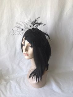 HatsByJosie: This black feathered fascinator hat is ideal for wedding, mother of the bride, women church hat, Kentucky Derby hat, tea Party hat or any other special occasion. Easy to wear Can be worn on both sides Floaty feathers Dotted floaty veil Free standard shipping Shipping upgrades available: Priority shipping 2-3 business days Express shipping 1-2 business days Love what you see would like a different color? Please feel free to send a message we'd love to create a hat for you. Looking fo Hat With Feather, Hat With Veil, Hat Tea Party, Wedding Mother Of The Bride, Red Fascinator, Kentucky Derby Fascinator, Church Weddings, Derby Fascinator, Women Church