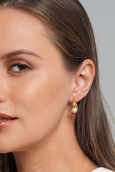 Description Get ready for a captivating night out with our Anuket 18k Gold C Hoop Earrings. Adding a pop of red lipstick, slip into a chic black dress, and put on a dainty gold necklace. The finishing touch? These exquisite C hoop earrings that effortlessly blend sophistication and modern charm. Step into the night with confidence, turning heads and making a statement with your radiant style. Material Handpicked shell pearls: Crafted from shell powder, these pearls undergo a meticulous process t Chic Yellow Gold Huggie Earrings, Gold Chic Huggie Earrings For Formal Occasions, Chic Gold Huggie Earrings, Chic Gold-plated Huggie Earrings, Chic Gold Plated Huggie Earrings, Elegant Gold Huggie Earrings For Party, Elegant Small Hoop Huggie Earrings For Party, Elegant Huggie Earrings For Party, Evening Hoop Jewelry With Matching Earrings