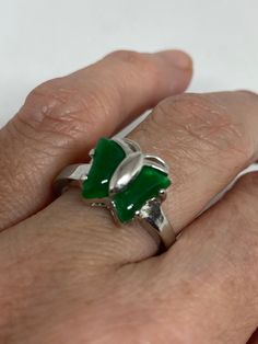 Vintage green nephrite jade Ornate German Silver ring, does not tarnish, NOT sterling Sizes 6.5, 7, or 7.5 All rings are shipped in a nice gift box. Check out our over a THOUSAND great reviews Engraving is $4 per letter and is not always perfect depending on the piece. It can take a few days if the jeweler is busy. This is payable to Paypal Judithsltd@gmail.com Green Hallmarked Open Ring, Jade Open Ring Gift, Jade Open Ring As Gift, Jade Open Ring For Gift, Green Open Emerald Ring For Gift, Green Emerald Open Ring - Gift, Jade Ring For May Birthstone Gift, Jade Rings For May Birthstone, Green Open Ring Jewelry For Gift