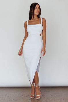 White midi dress Lined Elasticated shoulder straps Side split Strappy, tie-up back Stretchy fabric Steal the limelight in our hot Cosmic Love midi dress. We are in love with its strappy back and sexy, thigh-high split. Perfect for a special birthday celebration. Team it with white, strappy heels and a saddle bag for a look that will turn heads. MODEL INFO Model is wearing size S Height: 5'2" Bust: 33.5" Waist: 25" Hips: 35" CARE Hand Wash Cold. Do Not Iron. MATERIAL RAYON/SPANDEX Fitted Strappy Back Dress For Day Out, Fitted Dress With Strappy Back For Day Out, Summer Evening Backless Dress With Square Neck, Chic Fitted Midi Dress With Strappy Back, Tie-back Midi Dress For Night Out, Chic Strappy Back Midi Dress For Day Out, Flirty Backless Summer Midi Dress, Sleeveless Backless Dress With Adjustable Straps For Brunch, Fitted Strappy Back Sundress