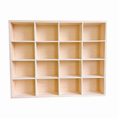 an empty wooden shelf with many compartments