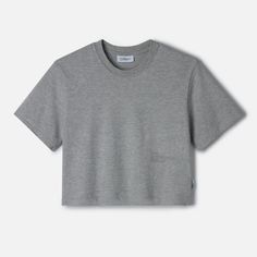 Streamline your wardrobe with The LOWGO Crop Tee, a shorter take on our signature LOWGO Tee. Made from soft, medium-weight 220gsm, 100% organic cotton, this t-shirt offers the same understated elegance with a modern, cropped silhouette. The subtle tone-on-tone logo, placed lower, discreetly nods to the brand’s commitment to refined minimalism, making it an effortless choice for those who appreciate subtle sophistication. Heather Grey Cotton T-shirt For Loungewear, Heather Grey Cotton T-shirt For Summer, Basic Boxy Fit Organic Cotton T-shirt, Gray Boxy Fit Cotton T-shirt, Gray Boxy Cotton T-shirt, Everyday Organic Cotton Crew Neck Cropped T-shirt, Everyday Organic Cotton Cropped T-shirt Crew Neck, Organic Cotton Crew Neck Cropped T-shirt For Summer, Organic Cotton Crew Neck T-shirt For Loungewear